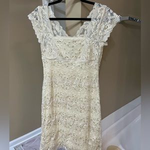 Size 10 ivory lace with beading. Stretchy material